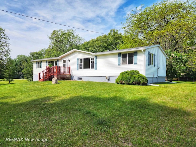 10424 S Graham Rd, Saint Charles, MI 48655 - manufactured / mobile home with a wooden deck and a front yard