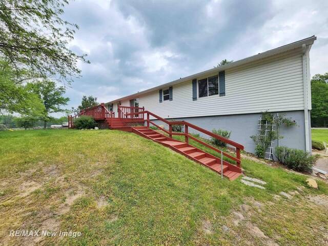 10424 S Graham Rd, Saint Charles, MI 48655 - back of house featuring a deck, a yard, and stairway