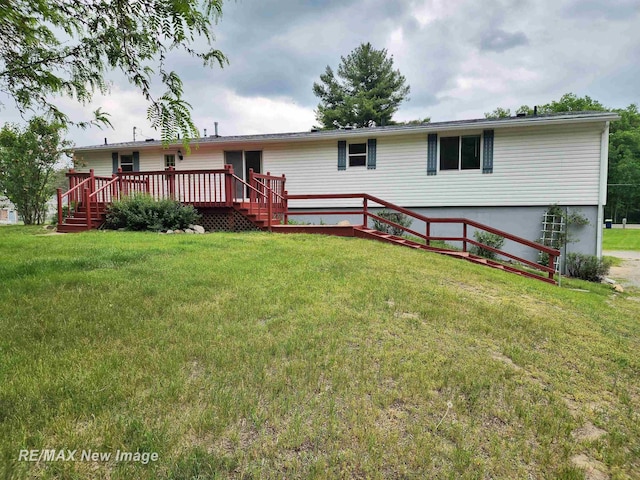10424 S Graham Rd, Saint Charles, MI 48655 - rear view of property featuring a wooden deck and a lawn