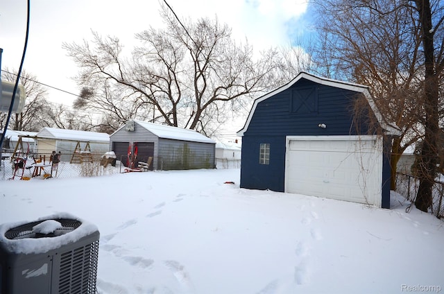 22813 Rosalind Ave, Eastpointe, MI 48021 - snow covered garage with a garage and central AC unit