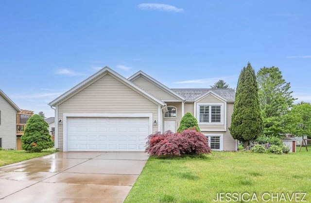 1369 Wiersma Dr, Zeeland, MI 49464 - view of front facade with concrete driveway, a front lawn, and an attached garage
