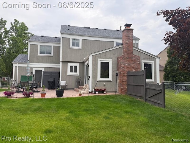 44195 Dartmouth St, Canton, MI 48188 - rear view of house featuring a patio, a chimney, and roof with shingles