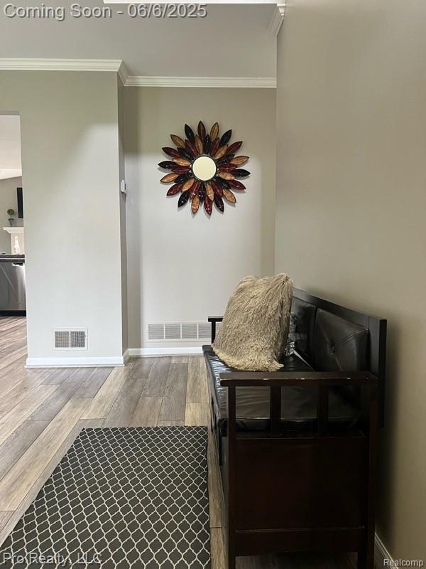 44195 Dartmouth St, Canton, MI 48188 - living area with ornamental molding, wood finished floors, and baseboards