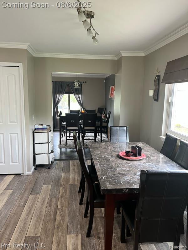 44195 Dartmouth St, Canton, MI 48188 - dining area with dark wood-type flooring and crown molding