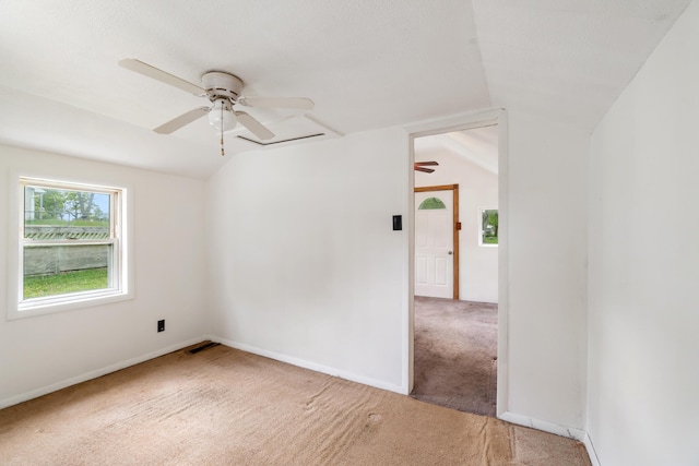 817 Annetta Ave, Jackson, MI 49203 - unfurnished room with ceiling fan, carpet floors, vaulted ceiling, and baseboards