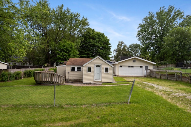817 Annetta Ave, Jackson, MI 49203 - view of front of home featuring an outdoor structure, a detached garage, and a wooden deck