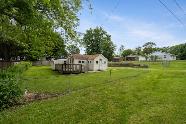 817 Annetta Ave, Jackson, MI 49203 - view of yard featuring a wooden deck and an outbuilding