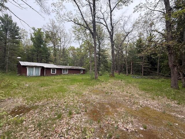 4465 E Old M-63, Luther, MI 49656 - view of yard featuring a view of trees