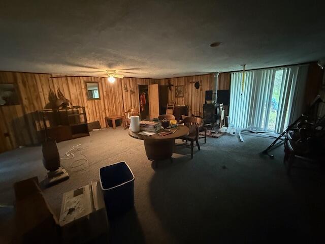 4465 E Old M-63, Luther, MI 49656 - carpeted living area featuring wooden walls