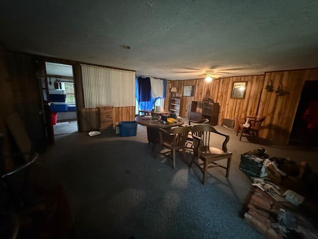 4465 E Old M-63, Luther, MI 49656 - carpeted dining room with wooden walls
