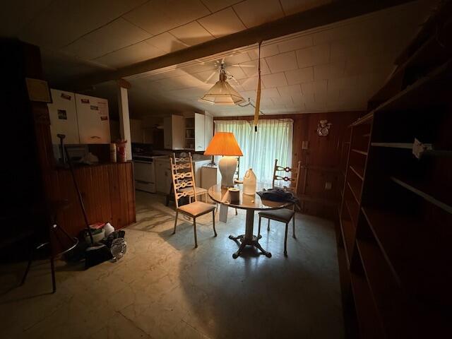 4465 E Old M-63, Luther, MI 49656 - sitting room featuring beamed ceiling and wooden walls