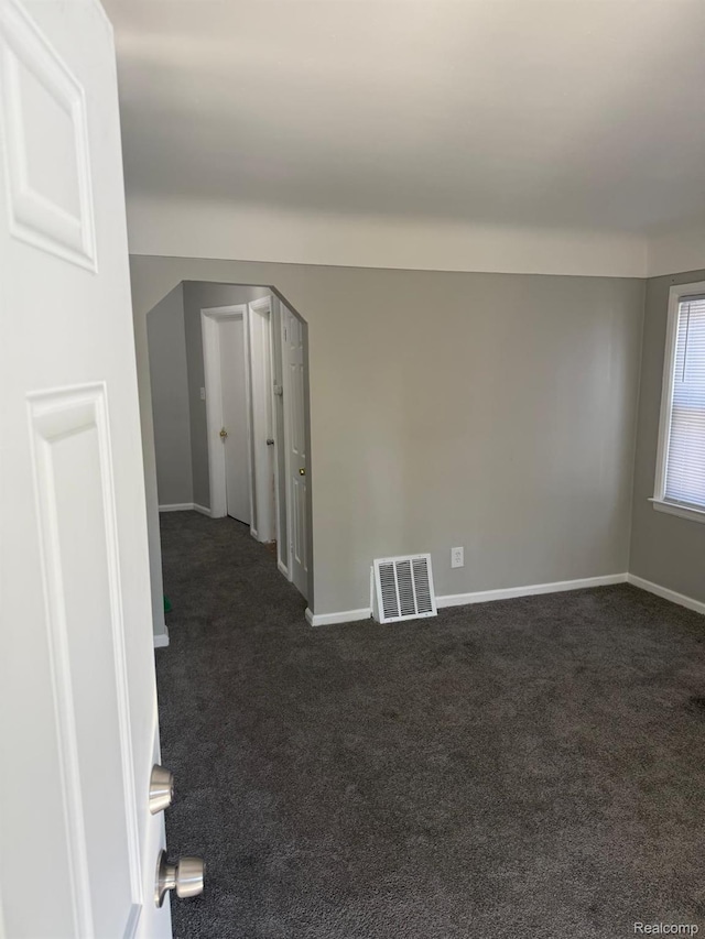 18950 Blackmoor St, Detroit, MI 48234 - spare room with dark colored carpet and baseboards