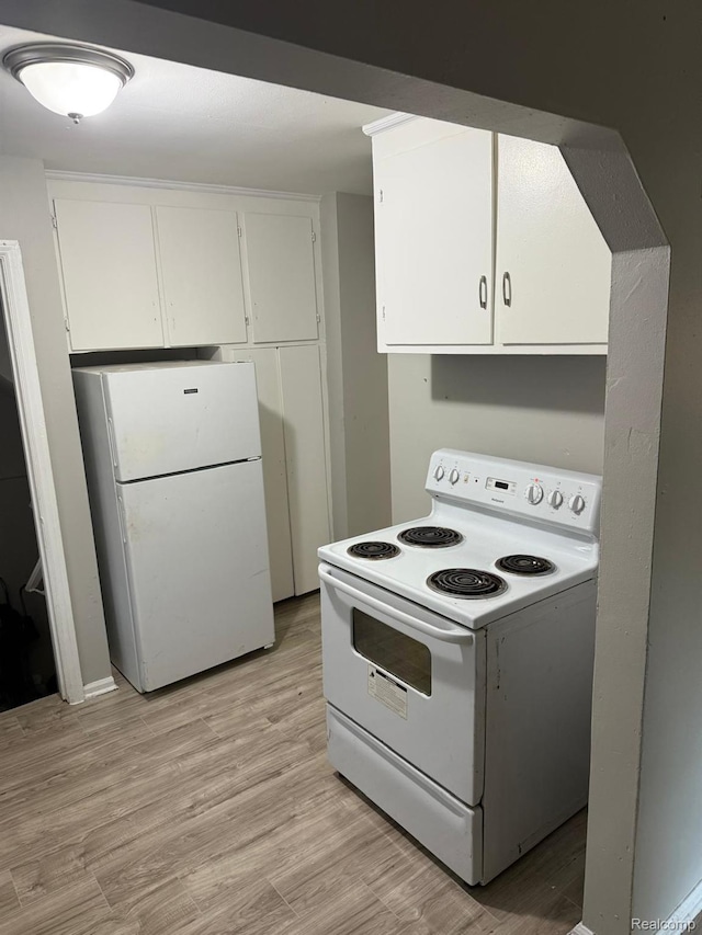 18950 Blackmoor St, Detroit, MI 48234 - kitchen featuring white appliances, white cabinetry, and light wood-style floors