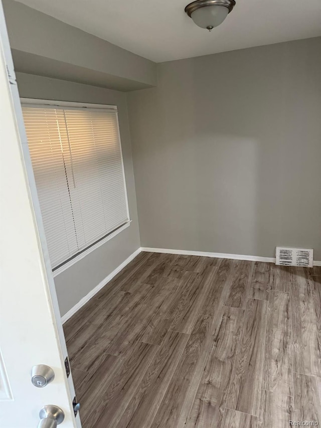 18950 Blackmoor St, Detroit, MI 48234 - spare room featuring wood finished floors and baseboards