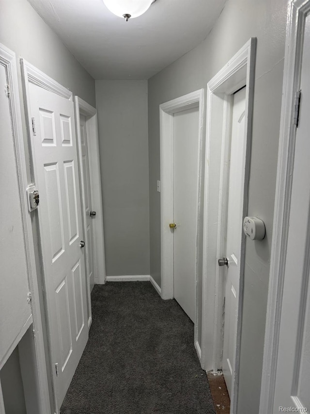 18950 Blackmoor St, Detroit, MI 48234 - hall featuring dark carpet and baseboards