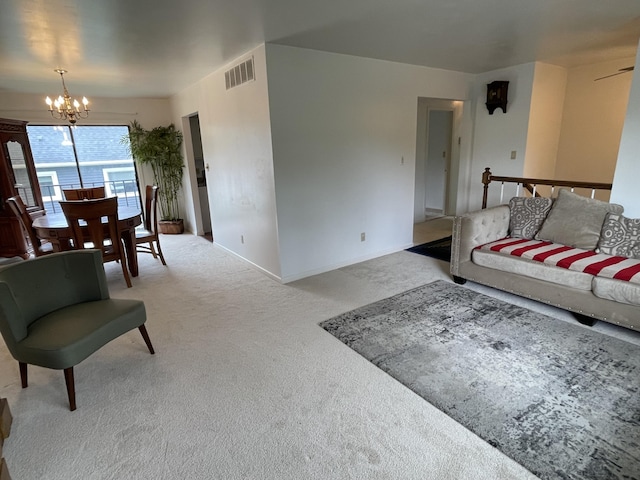 2323 Page Ave, Ann Arbor, MI 48104 - living area with a chandelier, carpet, and baseboards