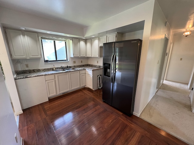 2323 Page Ave, Ann Arbor, MI 48104 - kitchen featuring refrigerator with ice dispenser, a sink, dark wood-style flooring, and baseboards