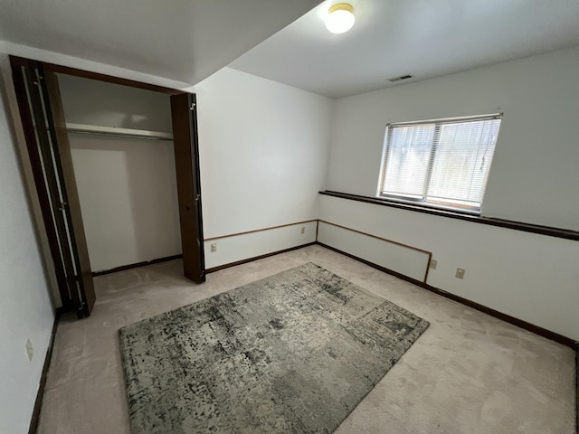 2323 Page Ave, Ann Arbor, MI 48104 - unfurnished bedroom with carpet floors, baseboards, and a closet