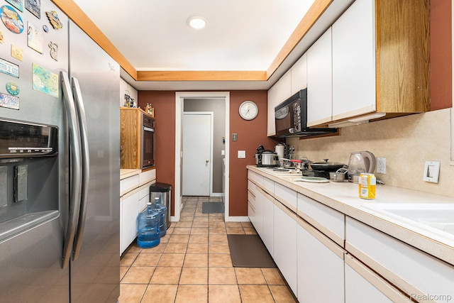 5130 Whitlow Ct, Commerce Twp, MI 48382 - kitchen with stainless steel fridge with ice dispenser, white cabinetry, light countertops, light tile patterned floors, and recessed lighting