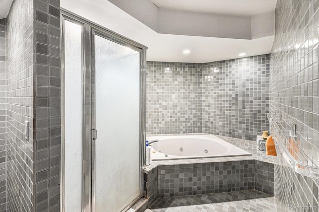 5130 Whitlow Ct, Commerce Twp, MI 48382 - bathroom featuring a jetted tub, tile walls, and a shower stall