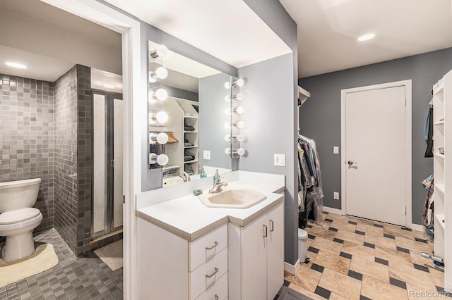 5130 Whitlow Ct, Commerce Twp, MI 48382 - full bath featuring toilet, vanity, a shower stall, recessed lighting, and tile patterned floors