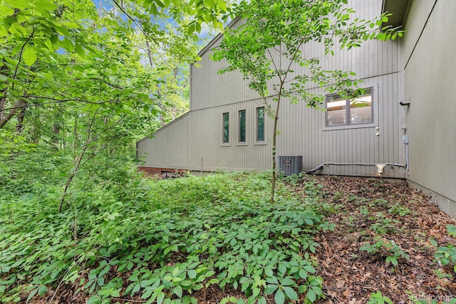 5130 Whitlow Ct, Commerce Twp, MI 48382 - view of property exterior with central AC unit