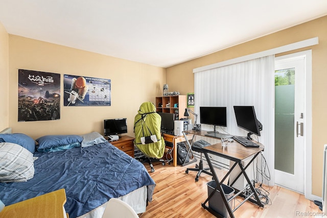 5130 Whitlow Ct, Commerce Twp, MI 48382 - bedroom featuring wood finished floors and an office area
