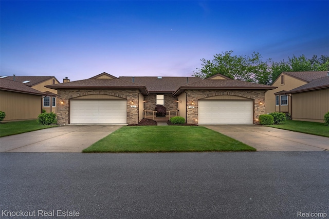 601 Churchgrove Rd, Frankenmuth, MI 48734 - single story home with driveway, an attached garage, a lawn, a shingled roof, and brick siding