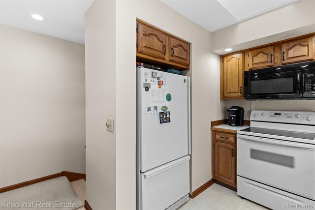 601 Churchgrove Rd, Frankenmuth, MI 48734 - kitchen with white appliances, brown cabinetry, baseboards, recessed lighting, and light countertops