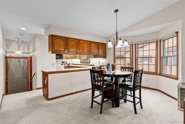 601 Churchgrove Rd, Frankenmuth, MI 48734 - dining area with a chandelier, baseboards, light carpet, and lofted ceiling