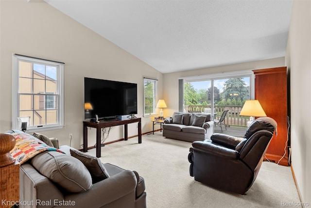 601 Churchgrove Rd, Frankenmuth, MI 48734 - living room with carpet floors, lofted ceiling, and baseboards
