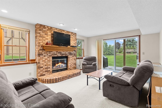 601 Churchgrove Rd, Frankenmuth, MI 48734 - carpeted living area with a brick fireplace, recessed lighting, and a textured ceiling