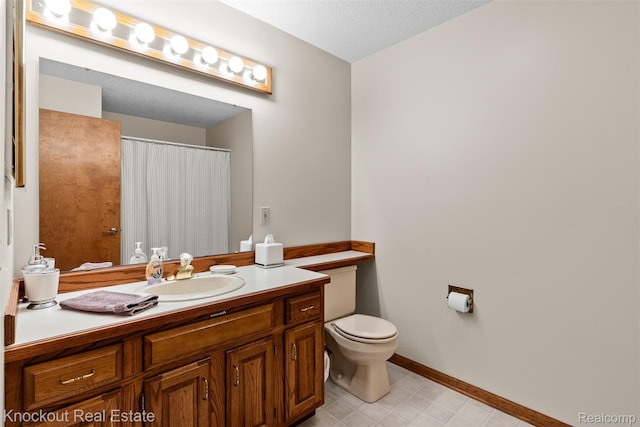601 Churchgrove Rd, Frankenmuth, MI 48734 - bathroom with vanity, toilet, baseboards, and curtained shower