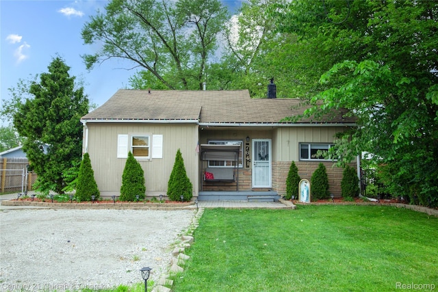 7641 N Inkster Rd, Westland, MI 48185 - view of front of property with a chimney, a shingled roof, and stone siding