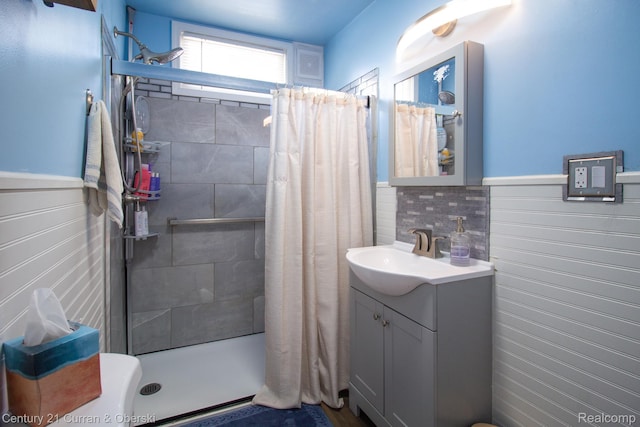 7641 N Inkster Rd, Westland, MI 48185 - full bath with vanity, a tile shower, and a wainscoted wall