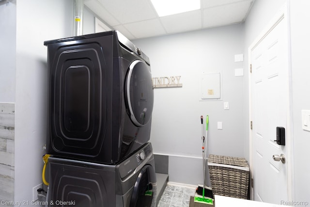7641 N Inkster Rd, Westland, MI 48185 - washroom featuring stacked washing machine and dryer and baseboards