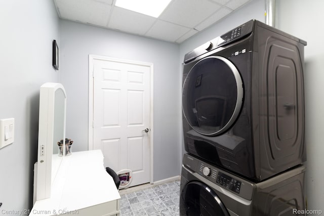 7641 N Inkster Rd, Westland, MI 48185 - laundry area featuring stacked washer / drying machine and baseboards
