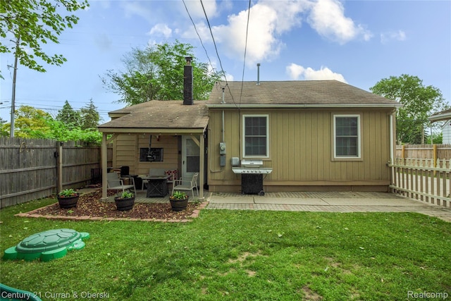 7641 N Inkster Rd, Westland, MI 48185 - rear view of property featuring a chimney, roof with shingles, and a patio area