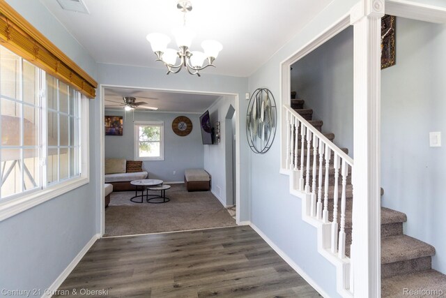 7641 N Inkster Rd, Westland, MI 48185 - entryway with stairs, a chandelier, baseboards, and dark wood-style flooring
