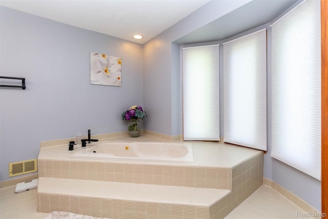 38649 Deerwood Ct, Northville, MI 48167 - bathroom featuring a tub with jets and tile patterned floors