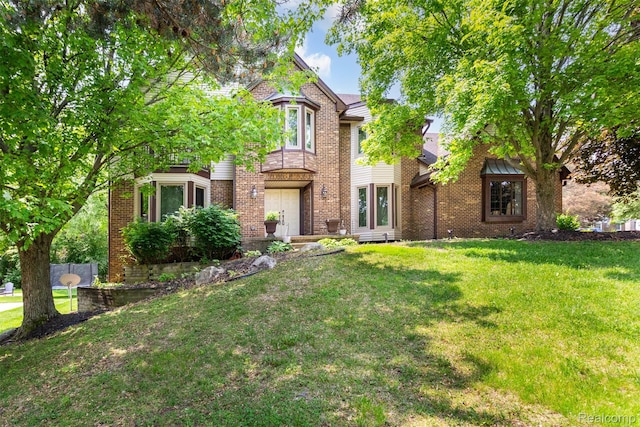 38649 Deerwood Ct, Northville, MI 48167 - view of front of home featuring a front yard and brick siding