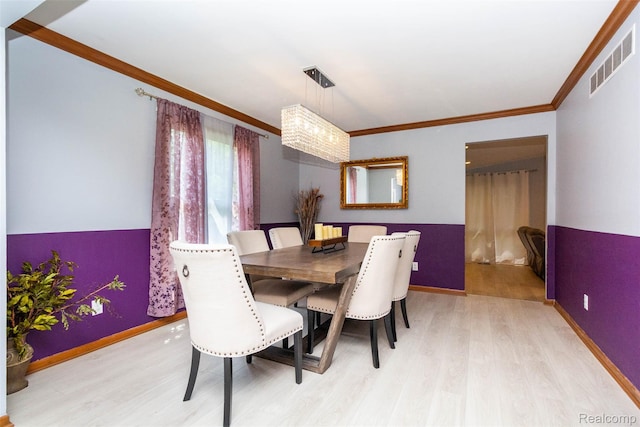 38649 Deerwood Ct, Northville, MI 48167 - dining space with light wood-style floors, crown molding, and baseboards