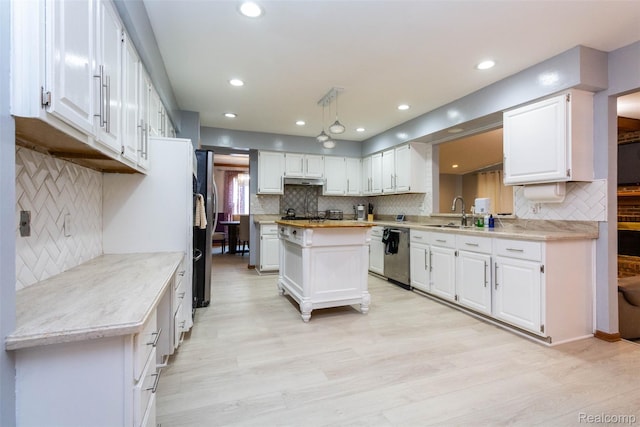 38649 Deerwood Ct, Northville, MI 48167 - kitchen with appliances with stainless steel finishes, backsplash, light countertops, and recessed lighting