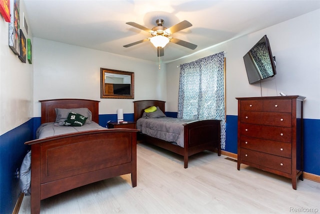 38649 Deerwood Ct, Northville, MI 48167 - bedroom with light wood-style flooring and a ceiling fan