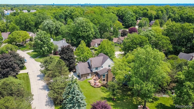 38649 Deerwood Ct, Northville, MI 48167 - aerial perspective of suburban area featuring a heavily wooded area