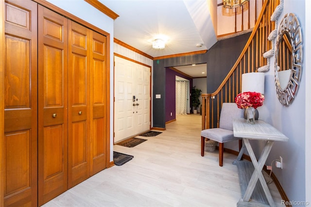 38649 Deerwood Ct, Northville, MI 48167 - foyer entrance with ornamental molding, stairway, baseboards, and light wood-style floors