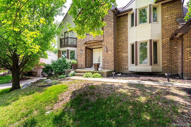 38649 Deerwood Ct, Northville, MI 48167 - view of front of property featuring a balcony and brick siding