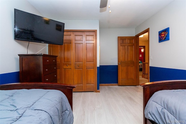 38649 Deerwood Ct, Northville, MI 48167 - bedroom featuring light wood-type flooring, a closet, and a ceiling fan