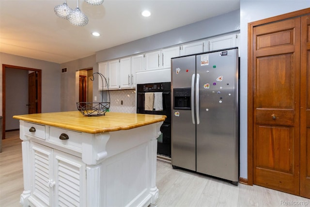 38649 Deerwood Ct, Northville, MI 48167 - kitchen with stainless steel fridge with ice dispenser, white cabinetry, light wood-type flooring, backsplash, and recessed lighting
