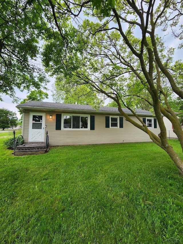 2285 Nebraska Ave, Saginaw, MI 48601 - rear view of house with a lawn